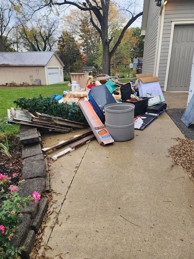 Dumpster being loaded with debris for Commercial Dumpster Rental in Odenville